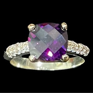 $8 or 3 for $20 Ring with faceted deep purple stone.